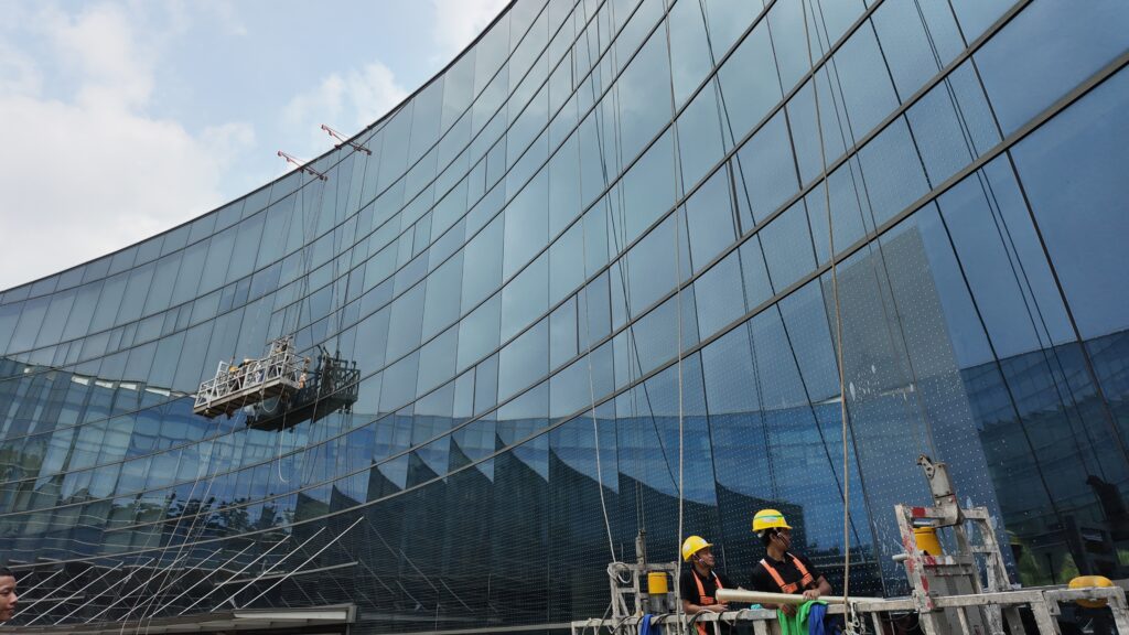 Installation of Anti Bird Strike Film with gondola lift on high rise external facade.